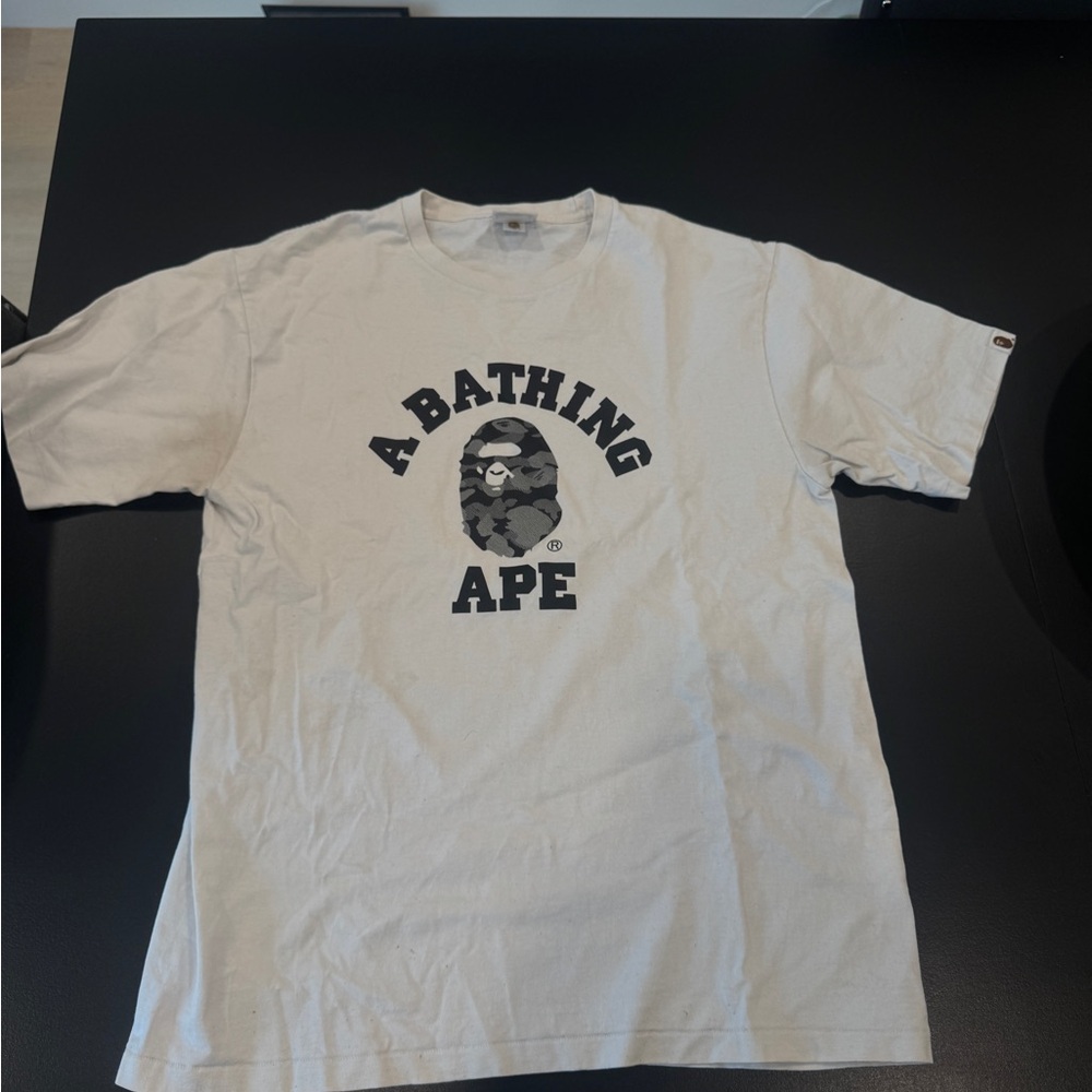 A Bathing Ape Graphic Tee in Light Beige with Black Logo